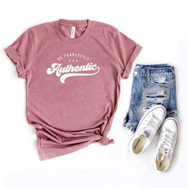 Unleash your true self with the Be Fearlessly Authentic graphic tee. This empowering design serves as a reminder to embrace your individuality and walk through life with confidence. Whether you're pairing it with jeans, skirts, or leggings, this comfortable short sleeve tee is a perfect fit for anyone who wants to make a bold statement.