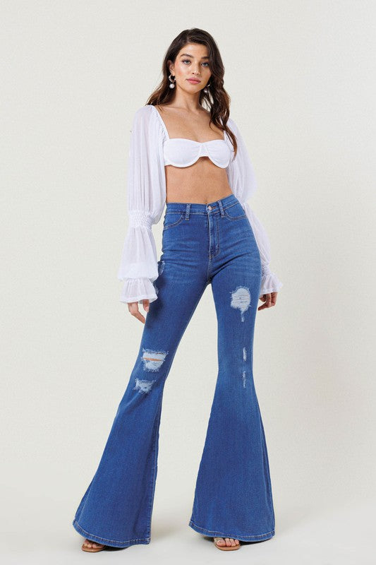 High-Rise Distressed Flare Jeans – Bold, Edgy, and Timeless