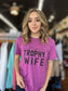 Let your wife know she's a trophy with this stylish Trophy Wife Tee. Featuring fun and cheeky messaging, she'll love the look and sentiment. Even when she's in her messy hair, sweatpants, and munching on take out food, she's still a winner in your eyes!